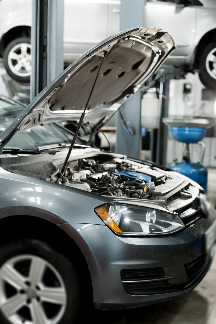 car being worked on in repair shop